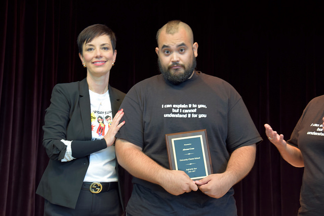 Abraham Cruz standing next to Dr. Melissa Chavez, UT-UCS Superintendent, at the summer convocation ceremony, where he received the Staff of the Year Award.