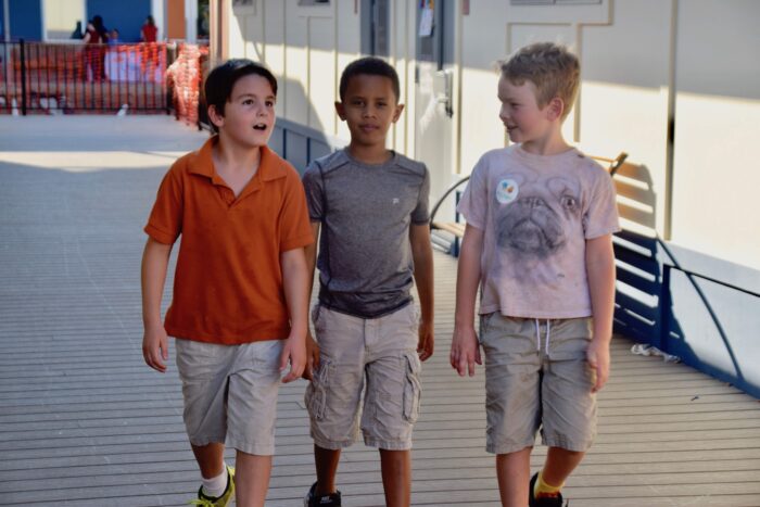 three boys walking