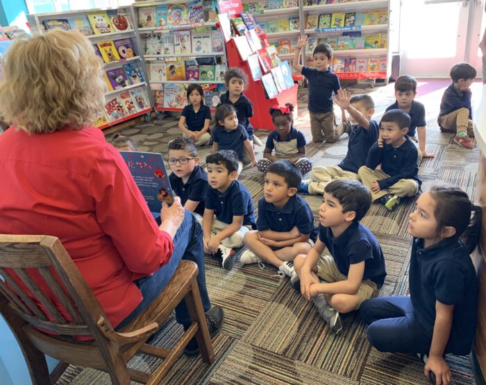 Ms. Evans reading to PreK