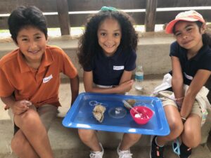 three students smiling