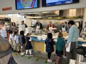 Volunteers serving lunch at the 2022 Thanksgiving Luncheon