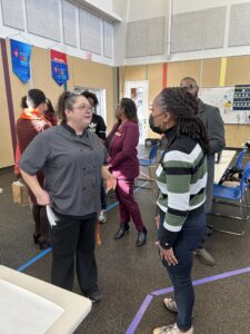 Chef Kim speaking to Austin City Council Member Natasha Harper Madison