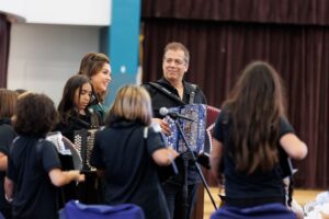 Joel Guzman and his accordion students