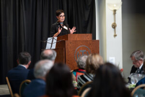 Dr. Melissa Chavez at podium during PreK to PhD event