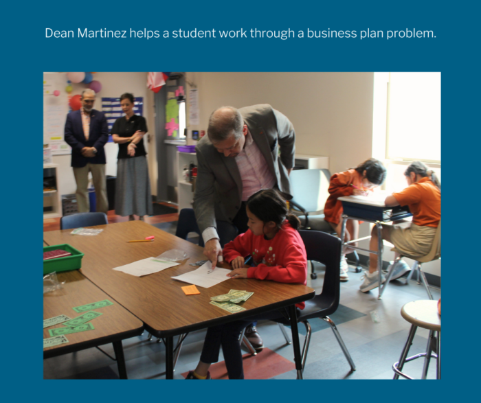 Dean Martinez helping student Maggie work on a problem