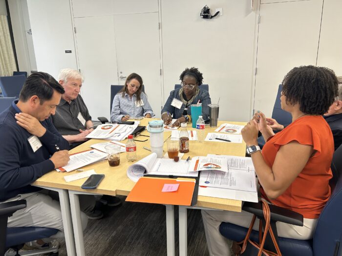 September 2024 board training photo with members Estrada and Kallison, finance director Davis, member McCarty-Harris and development director Leon-Wing. 