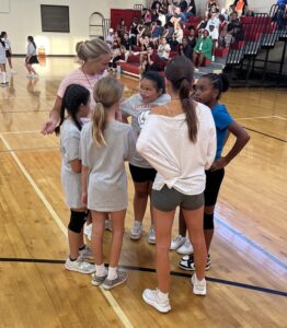 Little Longhorns huddle during their game