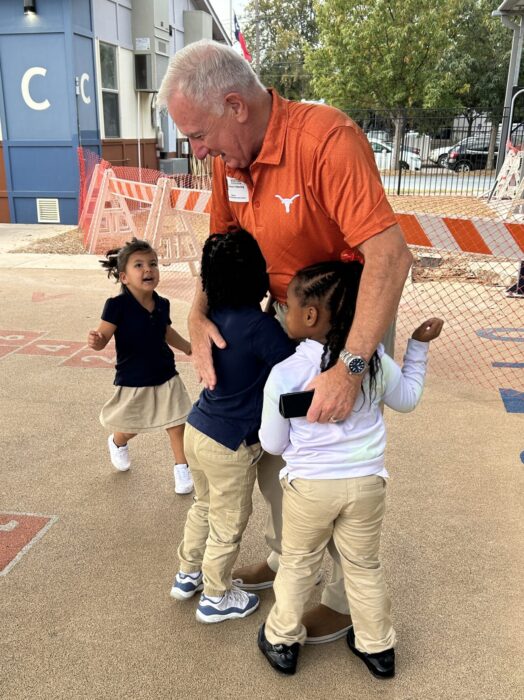 Volunteer Ronnie on the playground with Pre-K students