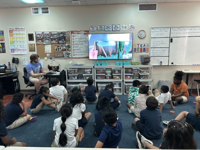 Author Joshua Otti reading his book "Leaf's Library" to students in STEAM Class.