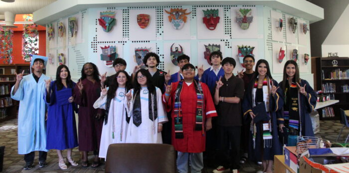 group of students from the UT Elementary class of 2018 in their graduation caps and gowns