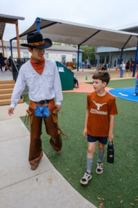 Evan Zhao and his mentee walk together during recess.