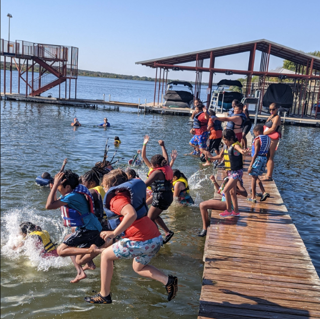 Outdoor school: Everyone jumping in the water from the dock